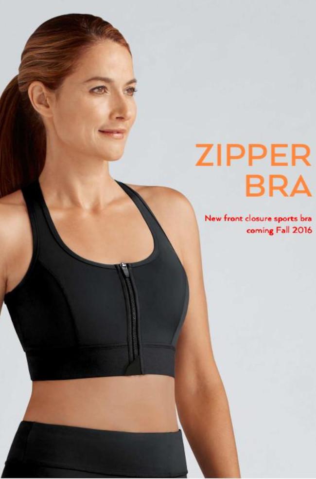 Black crop top with zipper top design by Amoena, available in sizes 2XL, 3XL, and 4XL for mastectomy support.