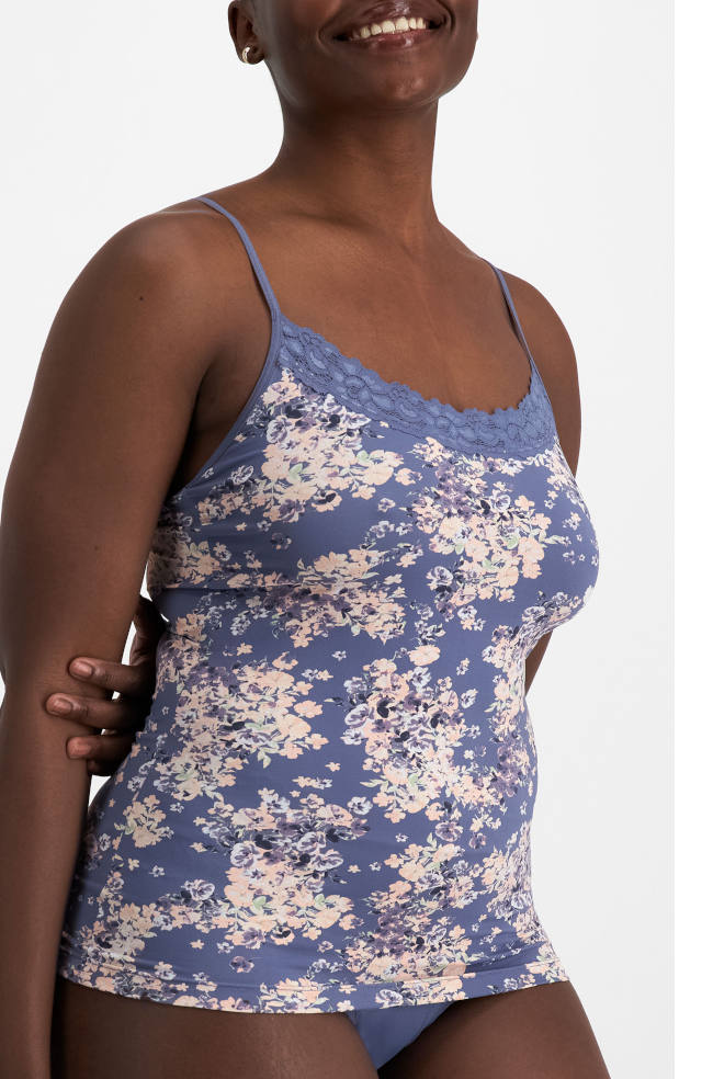Dusty blue floral lace trim camisole by Jockey with adjustable straps, available in sizes 10, 12, and 14.
