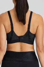 Black UW sports bra by Primadonna designed for larger cup sizes, featuring adjustable straps and a comfortable fit.