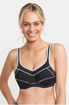 Black Triaction UW Performance Sports Bra by Triumph for larger cup sizes, featuring adjustable straps and breathable fabric