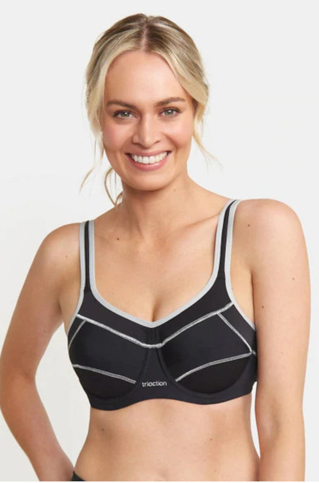 Black Triaction UW Performance Sports Bra by Triumph for larger cup sizes, featuring adjustable straps and breathable fabric