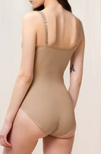 Nude shaping bodysuit with adjustable straps, size 16, by Triumph, designed for seamless support and shaping.